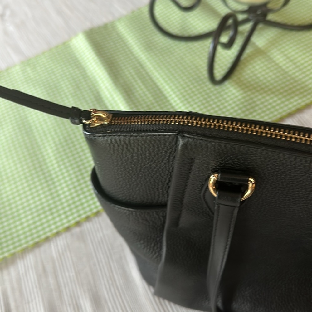 Michael Kors women’s handbag with bag feet on bottom. - Picture 9 of 11